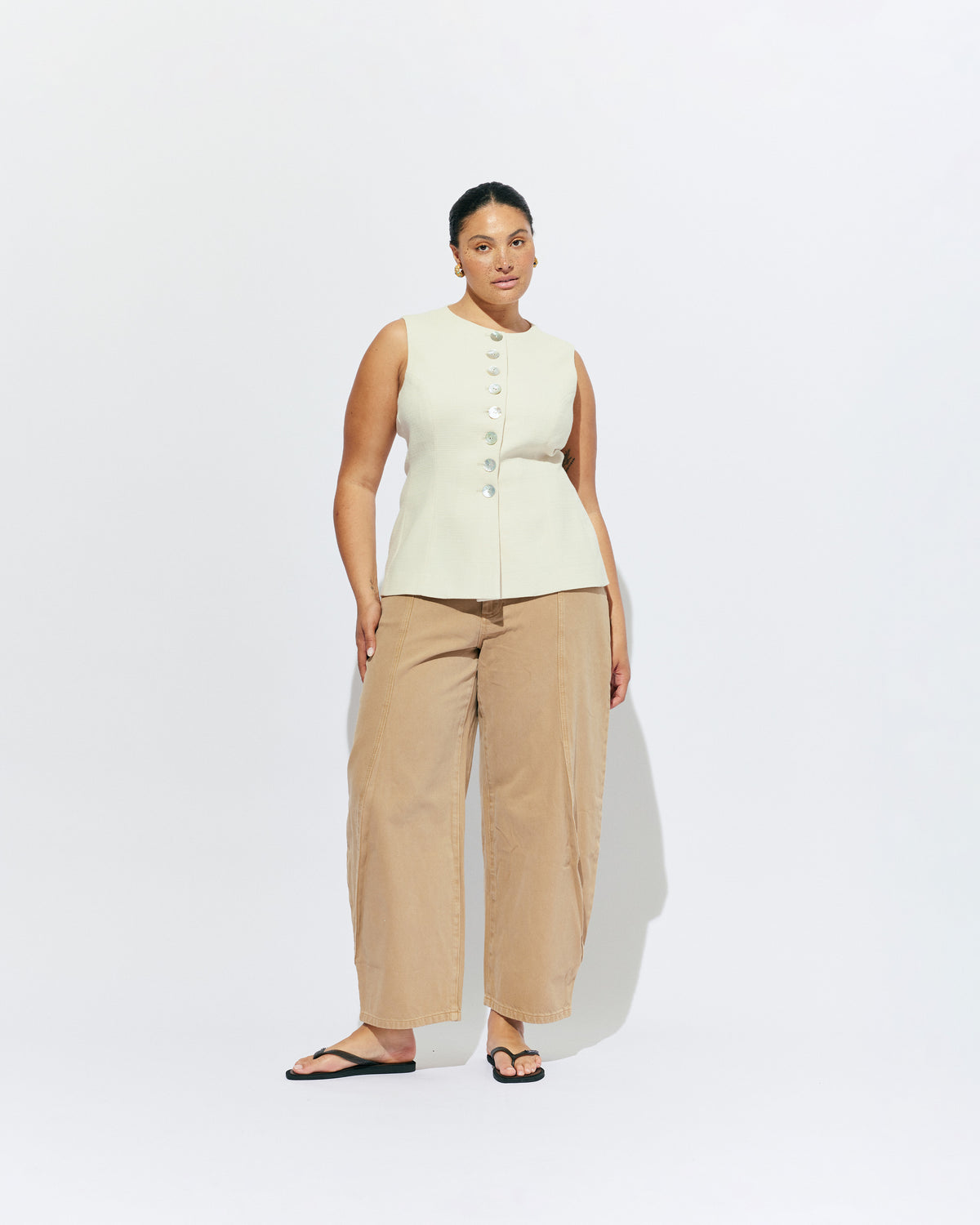 CAROLYN VEST CREAM | The Carolyn Vest is perfect for warmer months and layering, designed in a mid-weight black suiting fabric. Pair with your favourite shorts or suit trouser for an effortlessly polished look. Part of our workwear collection, the Carolyn Vest is a...