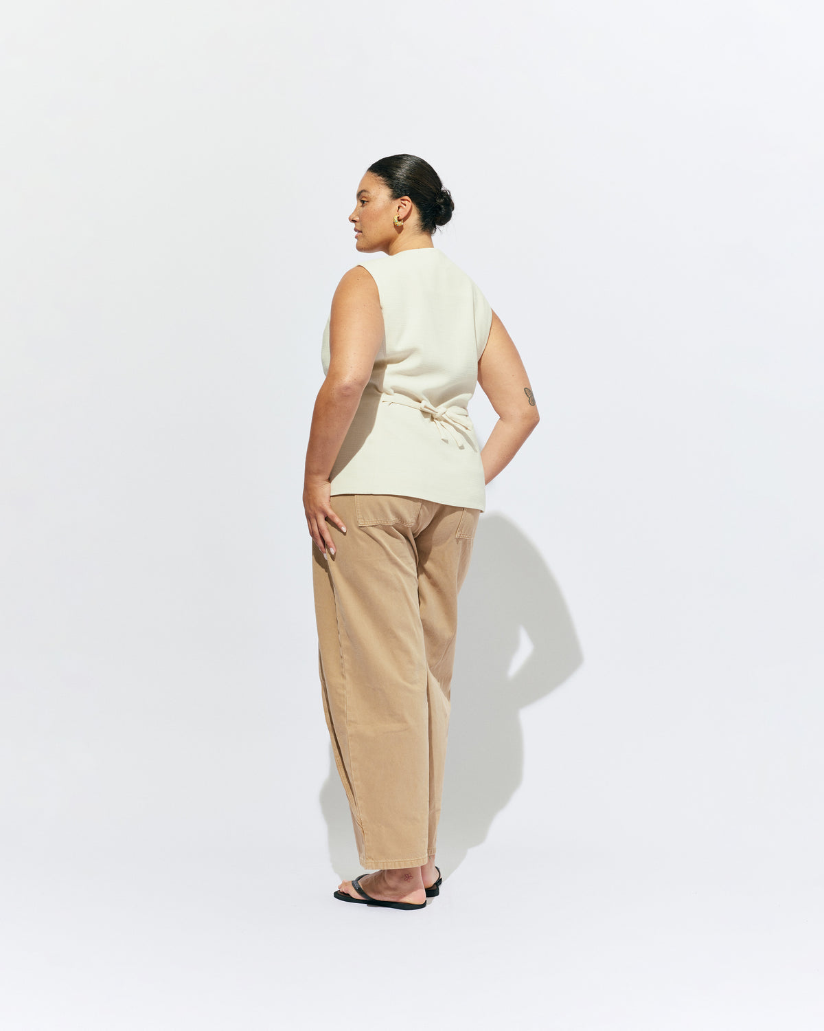 CAROLYN VEST CREAM | The Carolyn Vest is perfect for warmer months and layering, designed in a mid-weight black suiting fabric. Pair with your favourite shorts or suit trouser for an effortlessly polished look. Part of our workwear collection, the Carolyn Vest is a...