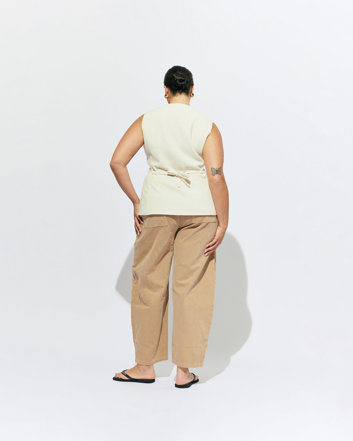 CAROLYN VEST CREAM | The Carolyn Vest is perfect for warmer months and layering, designed in a mid-weight black suiting fabric. Pair with your favourite shorts or suit trouser for an effortlessly polished look. Part of our workwear collection, the Carolyn Vest is a...