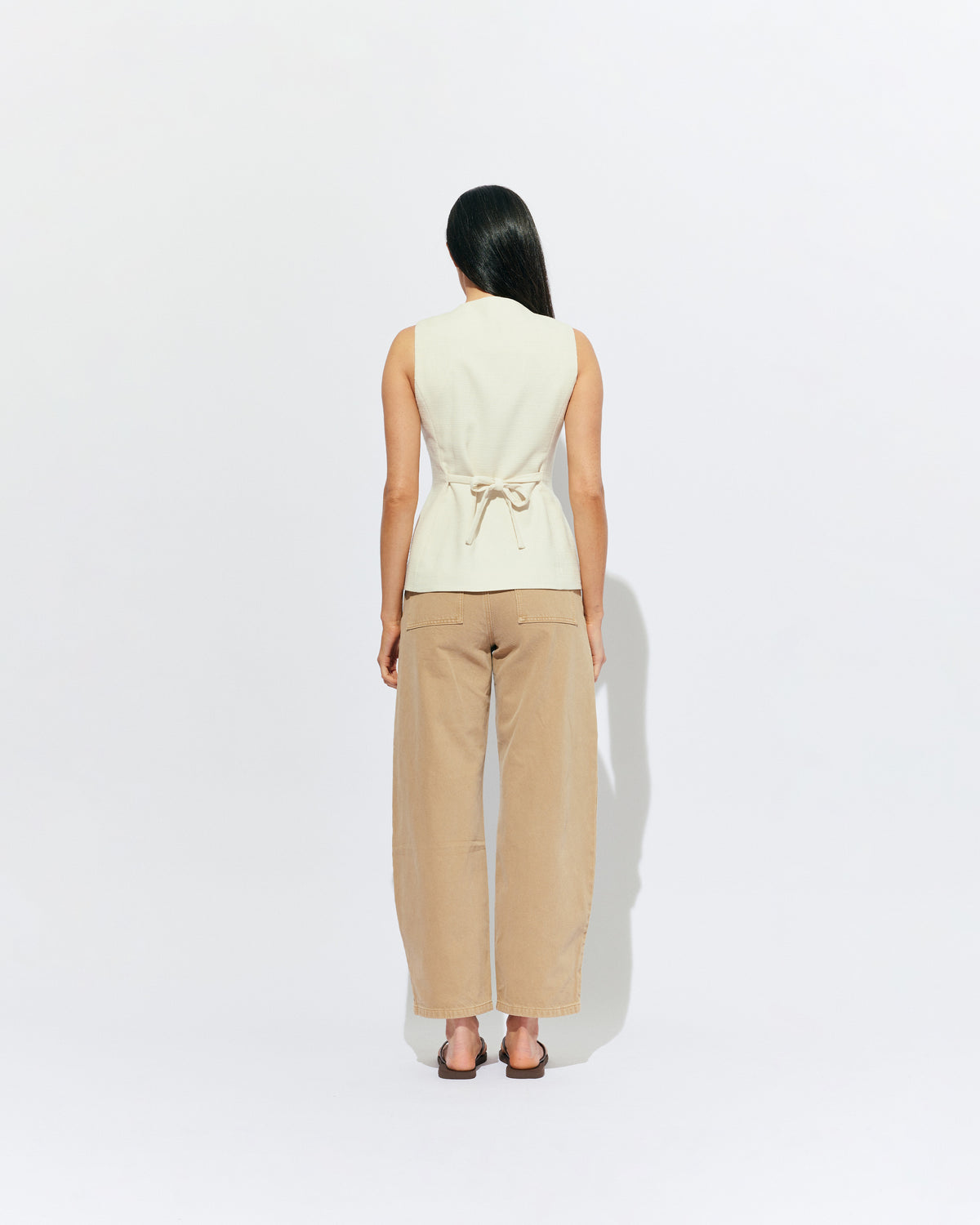 CAROLYN VEST CREAM | The Carolyn Vest is perfect for warmer months and layering, designed in a mid-weight black suiting fabric. Pair with your favourite shorts or suit trouser for an effortlessly polished look. Part of our workwear collection, the Carolyn Vest is a...