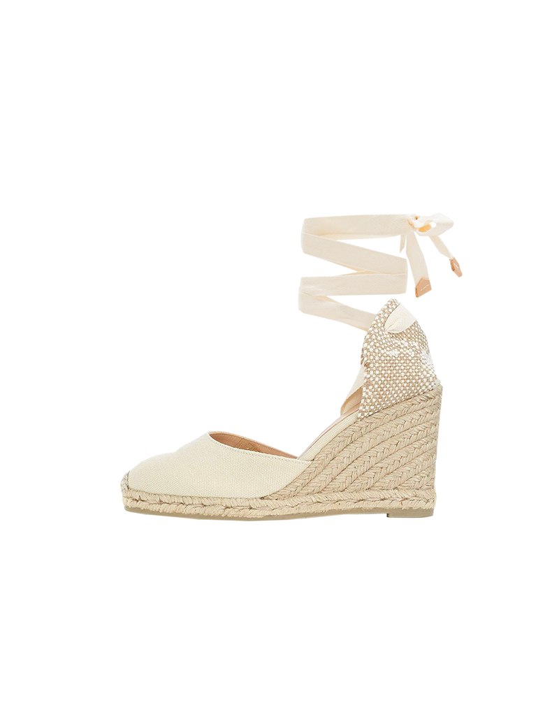 CARINA ESPADRILLES CREAM/TAN | Welcoming back the top selling Cariña espadrilles for summer! These are a woven jute wedge in black cotton canvas with a natural jute toe and black ribbon ties that wrap...