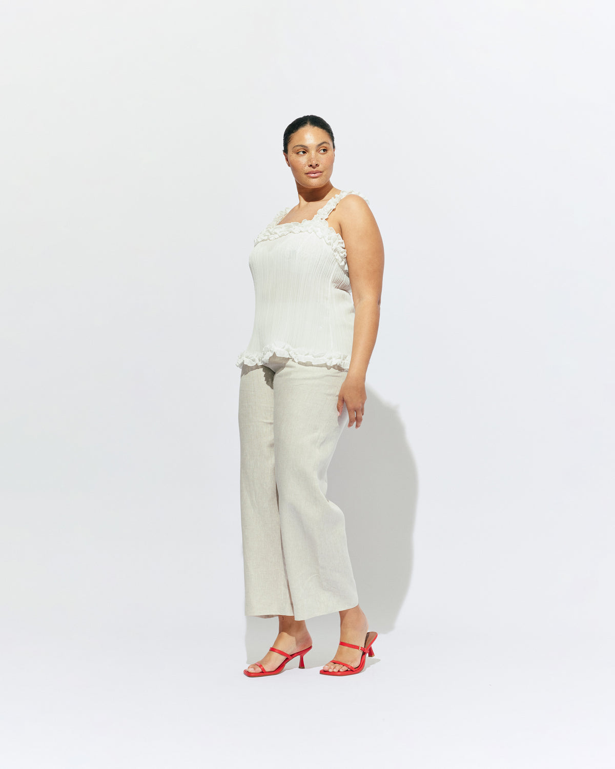 CHELSEA CRINKLE CAMI WHITE | A new arrival to our Chelsea Crinkle story, this white recycled chiffon cami features ruffles along all the seams. This top is the perfect statement piece for any occasion: layered with a singlet for the office, or showing off your...