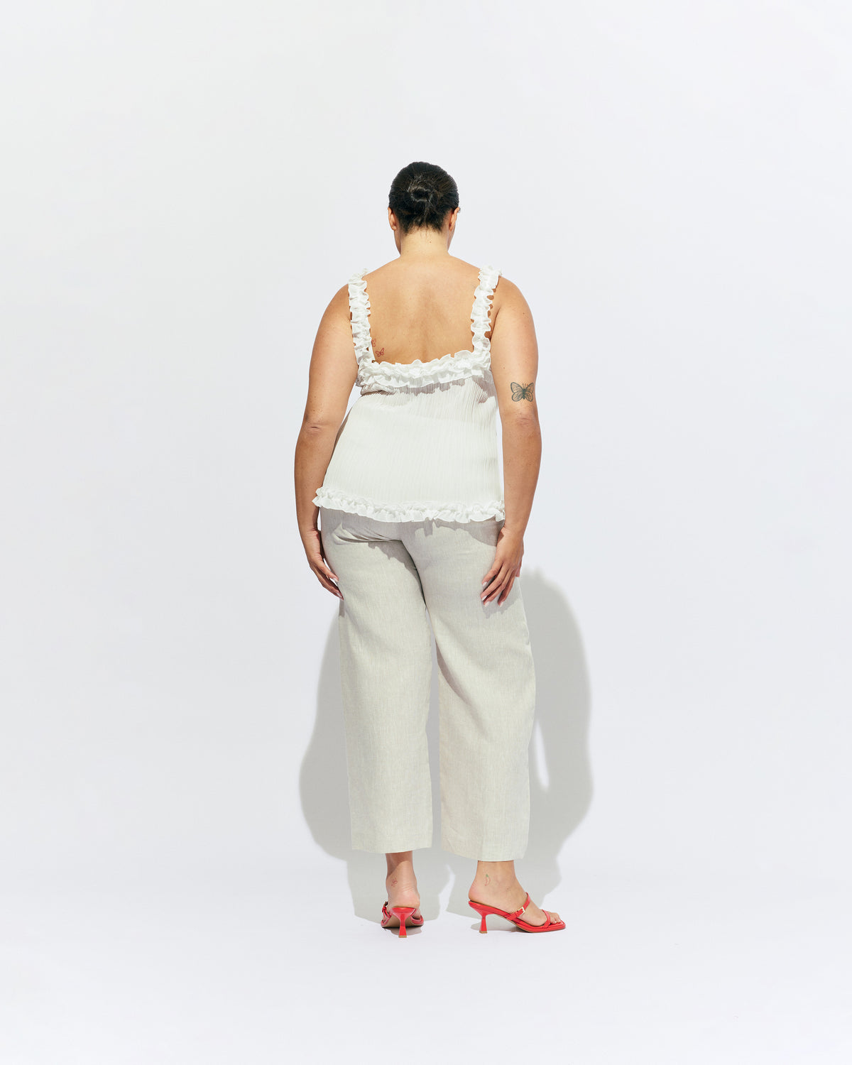 CHELSEA CRINKLE CAMI WHITE | A new arrival to our Chelsea Crinkle story, this white recycled chiffon cami features ruffles along all the seams. This top is the perfect statement piece for any occasion: layered with a singlet for the office, or showing off your...