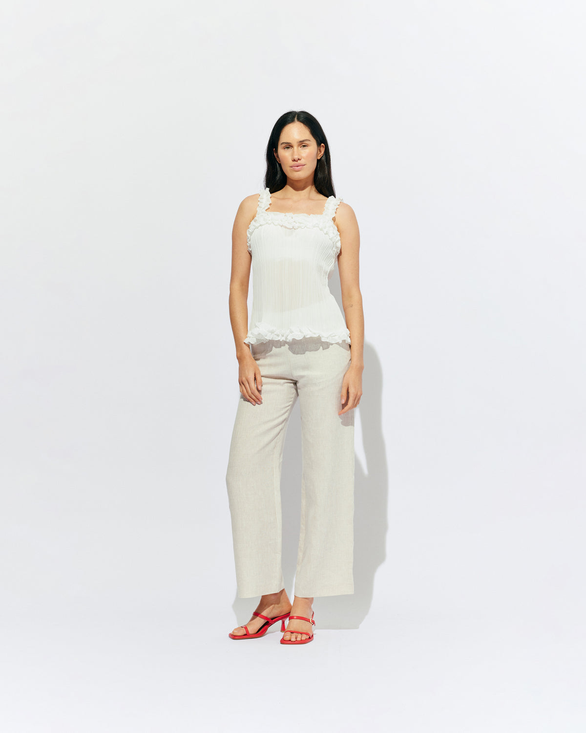 CHELSEA CRINKLE CAMI WHITE | A new arrival to our Chelsea Crinkle story, this white recycled chiffon cami features ruffles along all the seams. This top is the perfect statement piece for any occasion: layered with a singlet for the office, or showing off your...