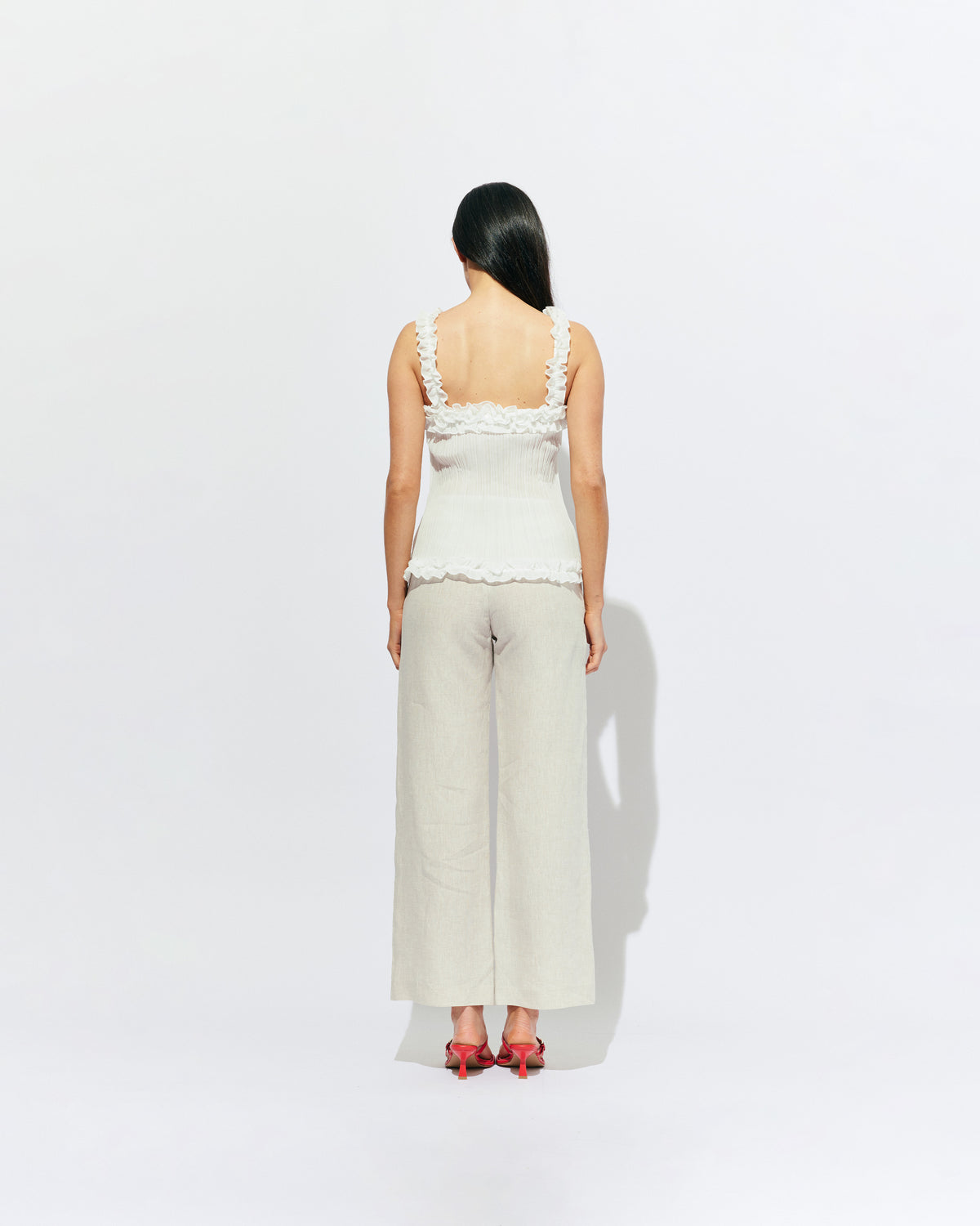 CHELSEA CRINKLE CAMI WHITE | A new arrival to our Chelsea Crinkle story, this white recycled chiffon cami features ruffles along all the seams. This top is the perfect statement piece for any occasion: layered with a singlet for the office, or showing off your...