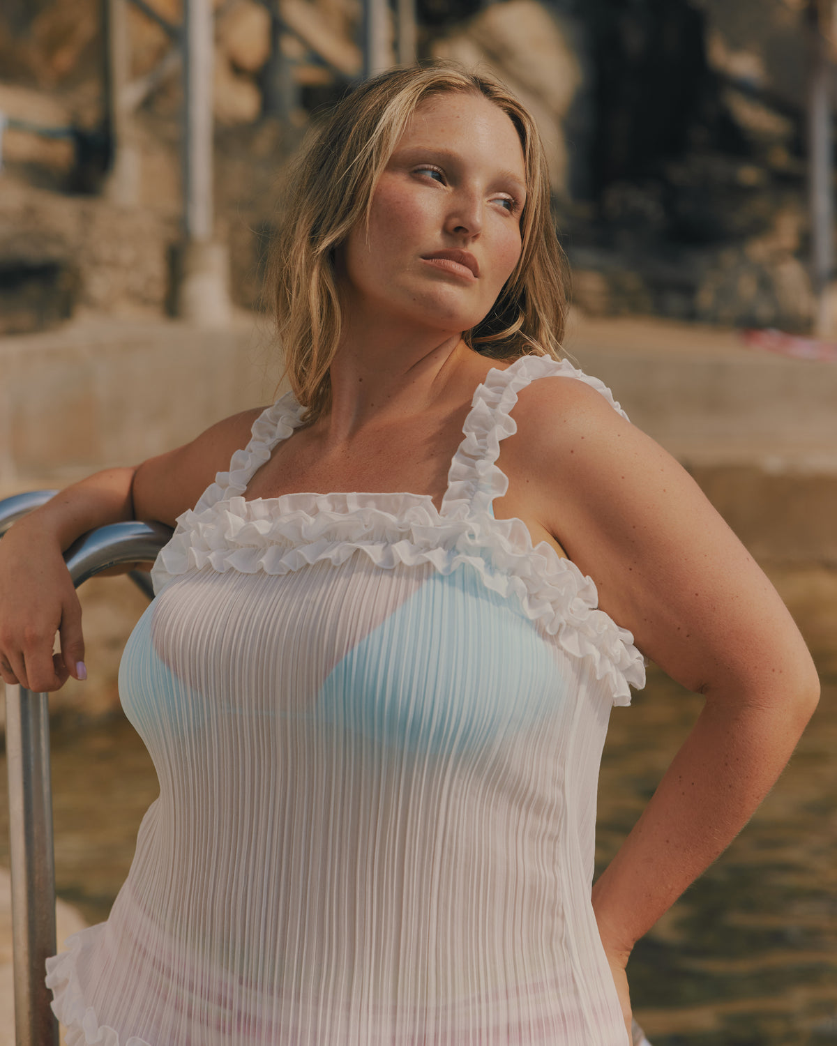 WYLIE TRIANGLE BIKINI TOP AQUA | Named after the Wylie's Baths in Sydney, this aqua bikini top is designed in a classic triangle style with a feature vermillion lace trim. With adjustable ties for a flexible fit, make it a set with the Wylie Tie-side Bikini...