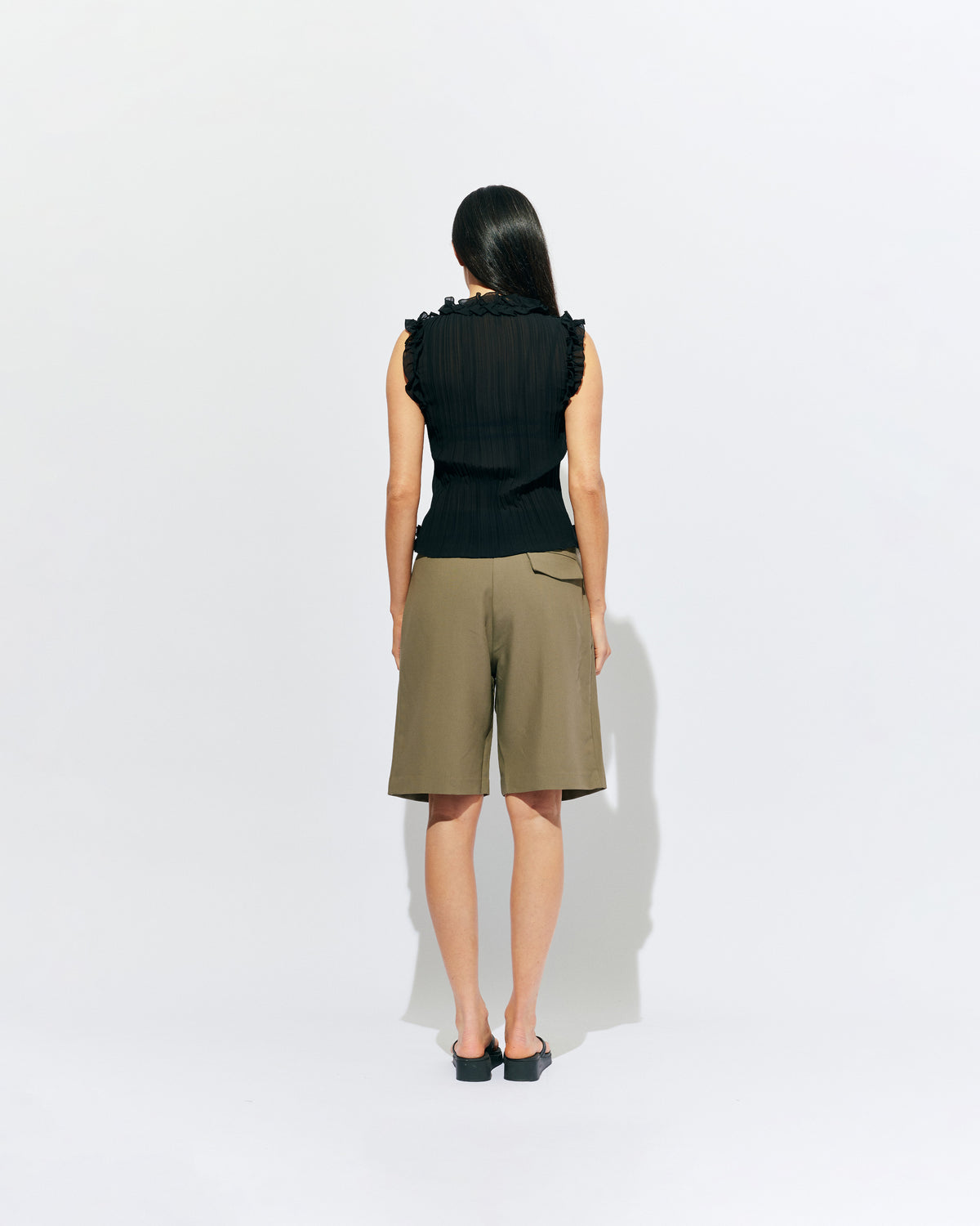 COCO SUIT SHORT MARTINI OLIVE | Classic suiting short designed in a midweight martini olive green, featuring front pleats, pockets and a wide leg. Make it a matching set with our Coco Short Sleeve Blazer or Carolyn Short Sleeve Blazer.