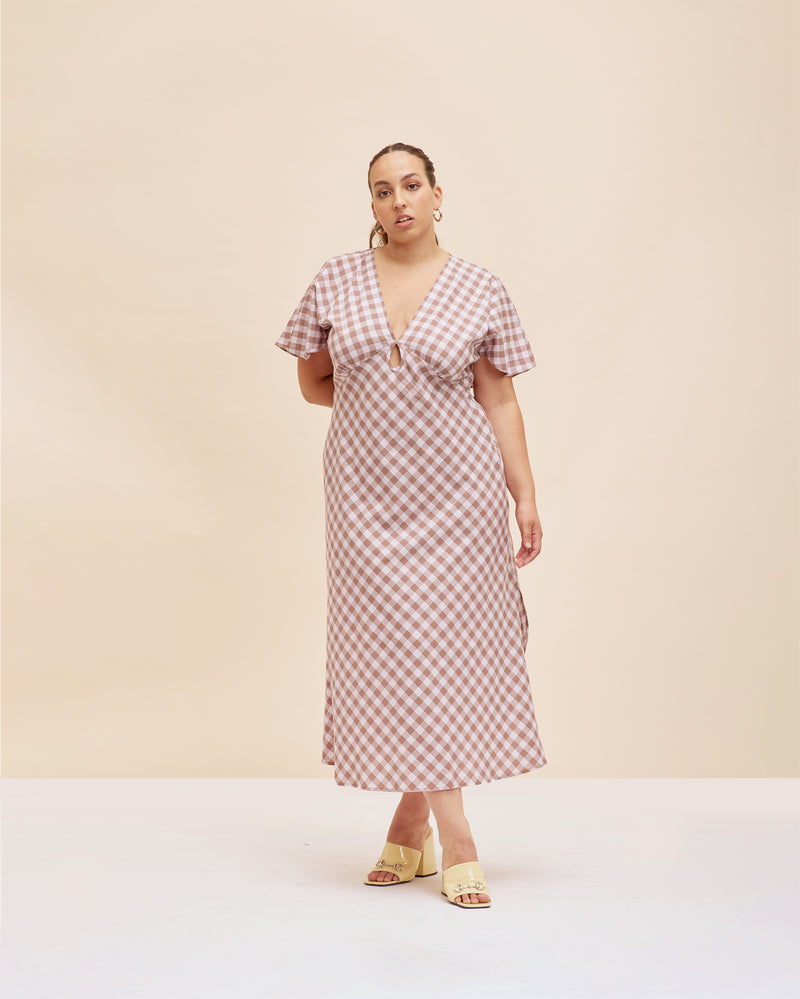 CLOVER MIDI DRESS LILAC GINGHAM | V-neck cotton midi dress with front keyhole detail, made in a lightweight lilac and brown gingham. Fitted around the waist flowing to an A-line skirt, this dress is a timeless...