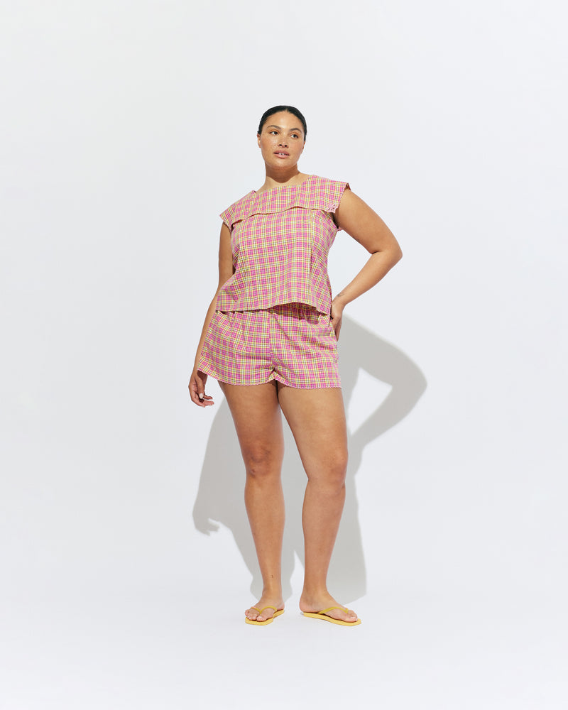 CRUSH COTTON SHORT PINK YELLOW TARTAN | Low-waisted organic cotton shorts, designed in our pink yellow tartan. Featuring a pink scalloped hem and broderie detailing on the sides, make it a matching set with the Crush Blouse or pair with your favourite tank. 