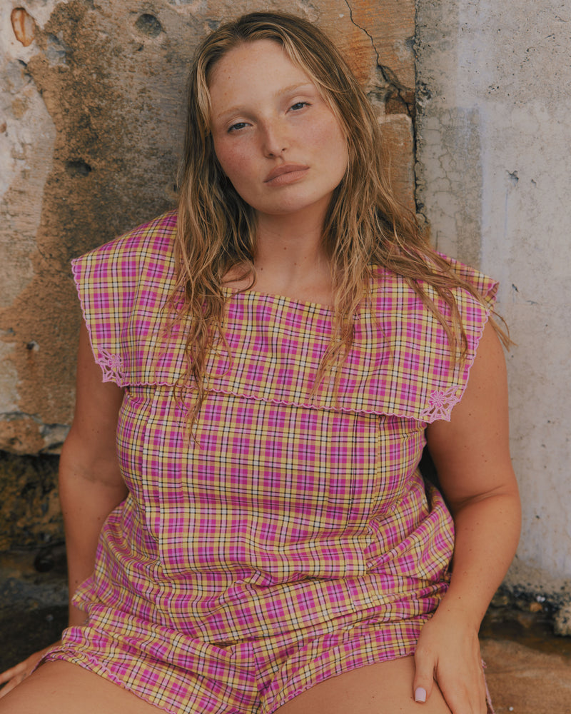 CRUSH COTTON SHORT PINK YELLOW TARTAN | Low-waisted organic cotton shorts, designed in our pink yellow tartan. Featuring a pink scalloped hem and broderie detailing on the sides, make it a matching set with the Crush Blouse or pair with your favourite tank. 