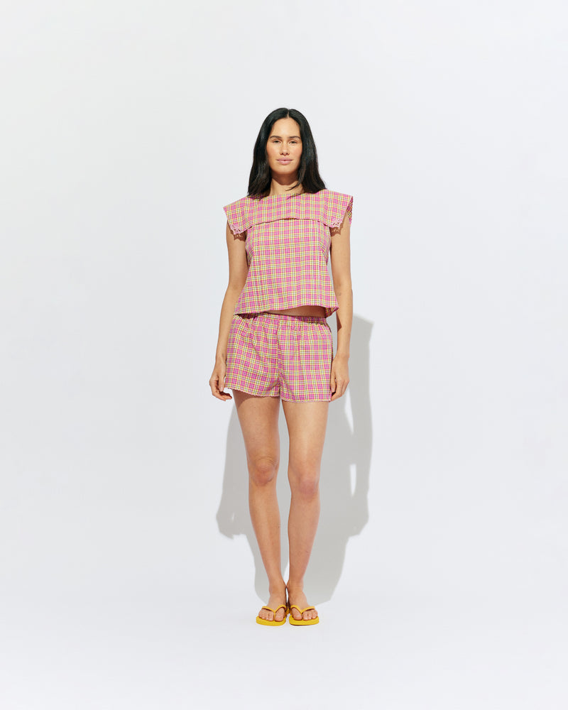 CRUSH COTTON SHORT PINK YELLOW TARTAN | Low-waisted organic cotton shorts, designed in our pink yellow tartan. Featuring a pink scalloped hem and broderie detailing on the sides, make it a matching set with the Crush Blouse or pair with your favourite tank. 
