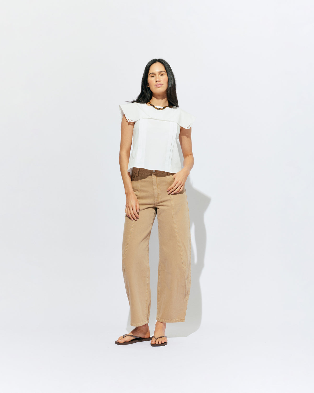 BUZZ JEAN SANDWASH | Your new everyday go-to, the Buzz Jean is a barrel-leg style pant, designed in a sandwash denim. Sits mid-waisted and features panel detailing down the front that wraps to the side seam.