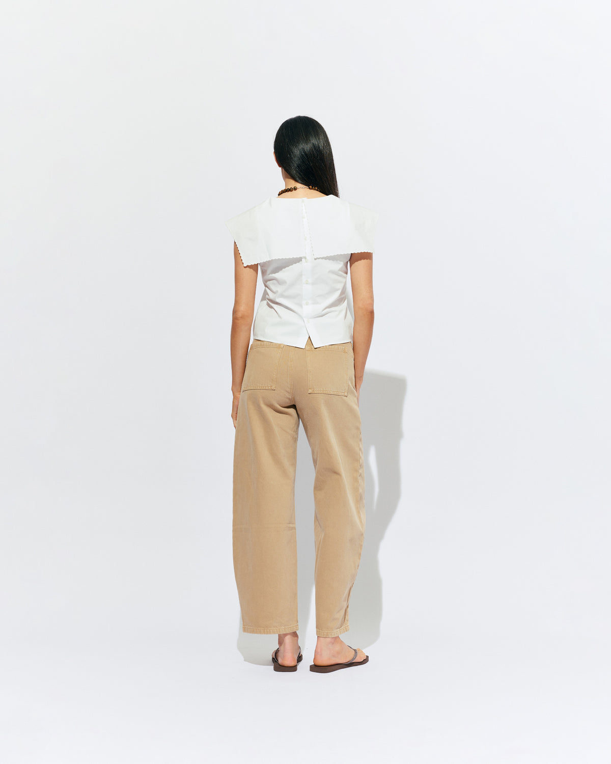 BUZZ JEAN SANDWASH | Your new everyday go-to, the Buzz Jean is a barrel-leg style pant, designed in a sandwash denim. Sits mid-waisted and features panel detailing down the front that wraps to the side seam.