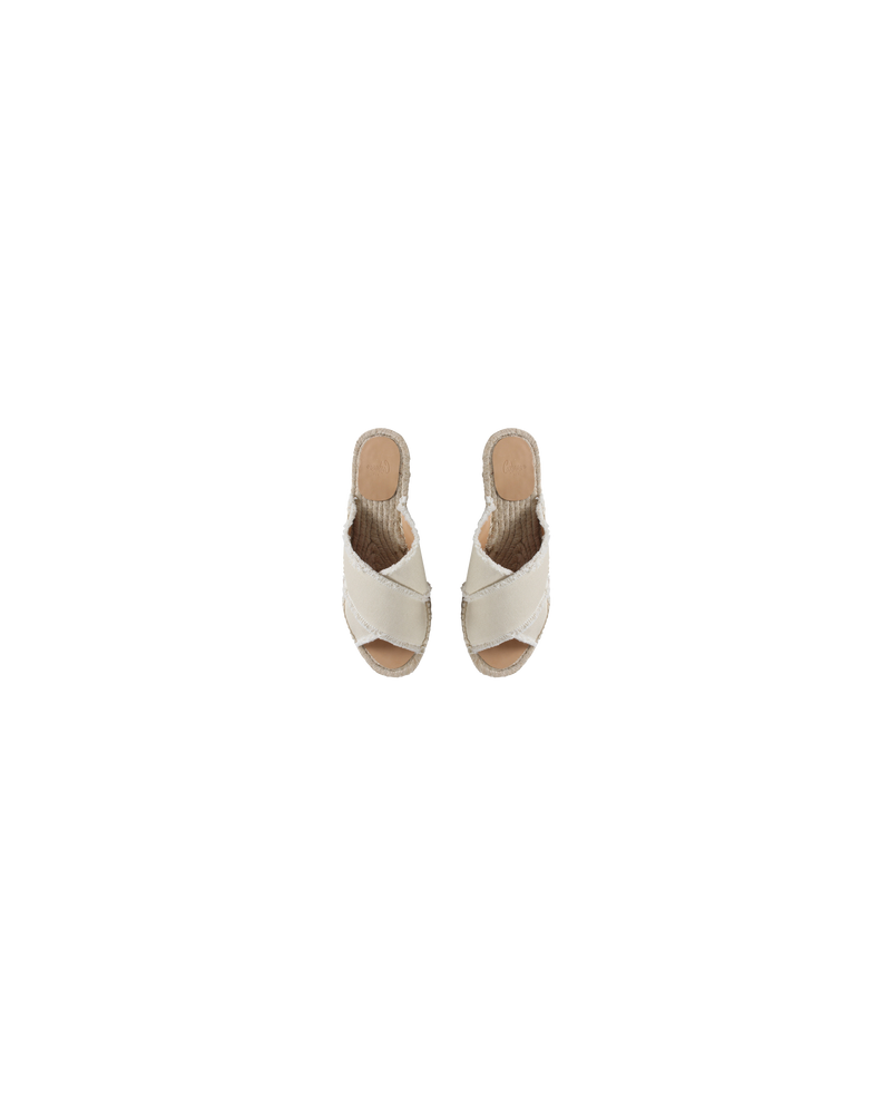 PALMERA SLIDES IVORY | Cotton espadrille slides with crossed straps and frayed finish, these shoes are the epitome of summer. A new flat style of the much loved Carina Espadrilles.