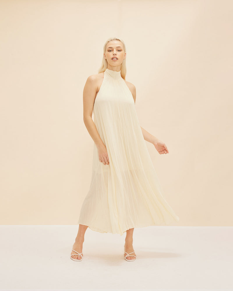 CASCADE CRUSH GOWN BUTTER | A RUBY favourite, this gown features crushed pleats and a halter neckline with dramatic back neck ties in black. The soft a-line shape and crushed pleating create beautiful movement as...