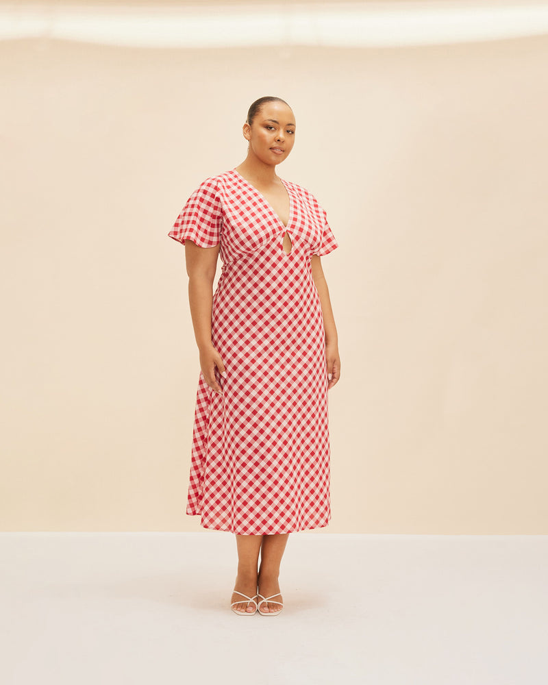 CLOVER MIDI DRESS RED GINGHAM | V-neck midi dress with front keyhole detail, made in a lightweight cotton gingham. Fitted around the waist flowing to an A-line skirt, this dress is a timeless piece.