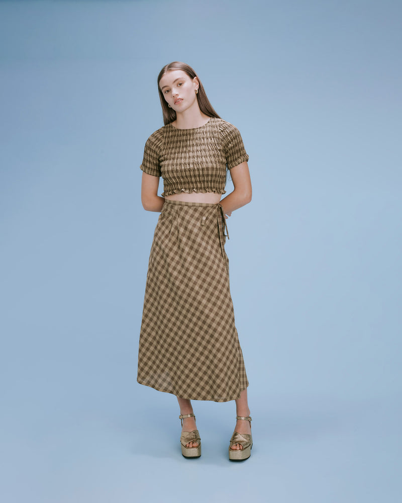 DARCY GINGHAM MIDI SKIRT OLIVE GINGHAM | Midi length wrap skirt that ties at the waist, in a two tone olive gingham. With a fluttery silhouette this skirt is a classic style you'll love for many years...