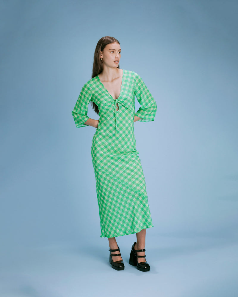 DIME SILK MIDI DRESS GREEN CHECK | Bias cut silk midi-dress featuring a keyhole tie detail at the neckline, in a RUBY exclusive green check print. The bias cut effortlessly skims your figure, and the keyhole feature...