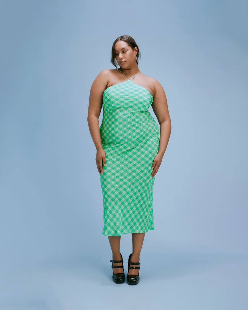 DIME SILK SLIP GREEN CHECK | Bias cut silk slip crafted in a RUBY exclusive green check print. The high strappy neckline of this piece adds a structured aesthetic to the otherwise soft silhouette.