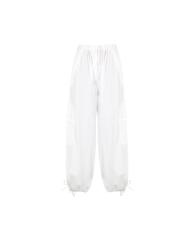 DONOVAN TIE PANT WHITE | Oversized, elastic waist cargo pants with front patch detailing and adjustable tie ankle cuffs. A contemporary take on classic cargo pants, these pants are designed for a loose fit through...