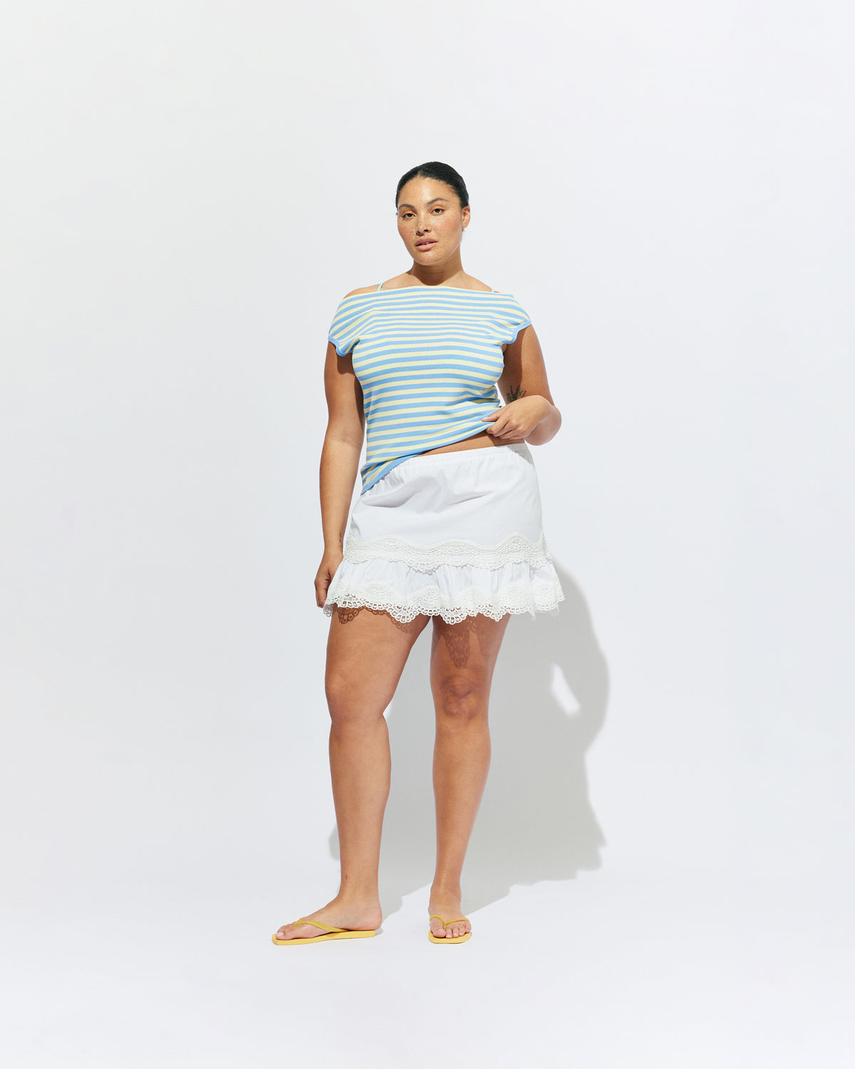 EMMA KNIT TOP BLUE BUTTER STRIPE | Off-shoulder knitted top crafted in a blue butter stripe, mid-weight knit. This top is simple yet fun and can be worn on or off the shoulder.