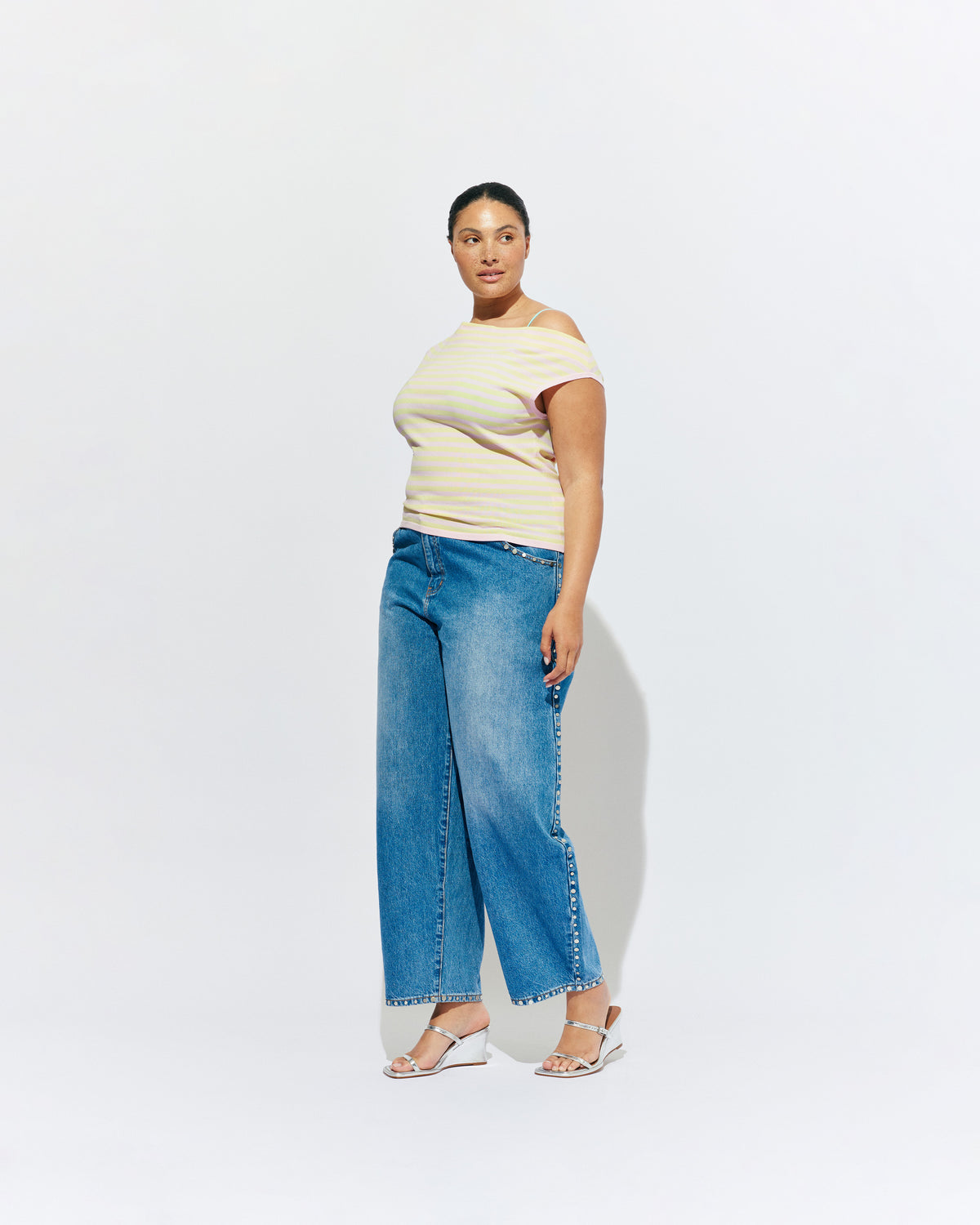 ICON STUDDED JEAN MIDTOWN BLUE | Barrel-leg jean designed in our signature midtown blue wash denim with studded seams. Sits mid to high-waisted with classic 5 pocket and waistband detailing. An updated version of our Icon Jean.