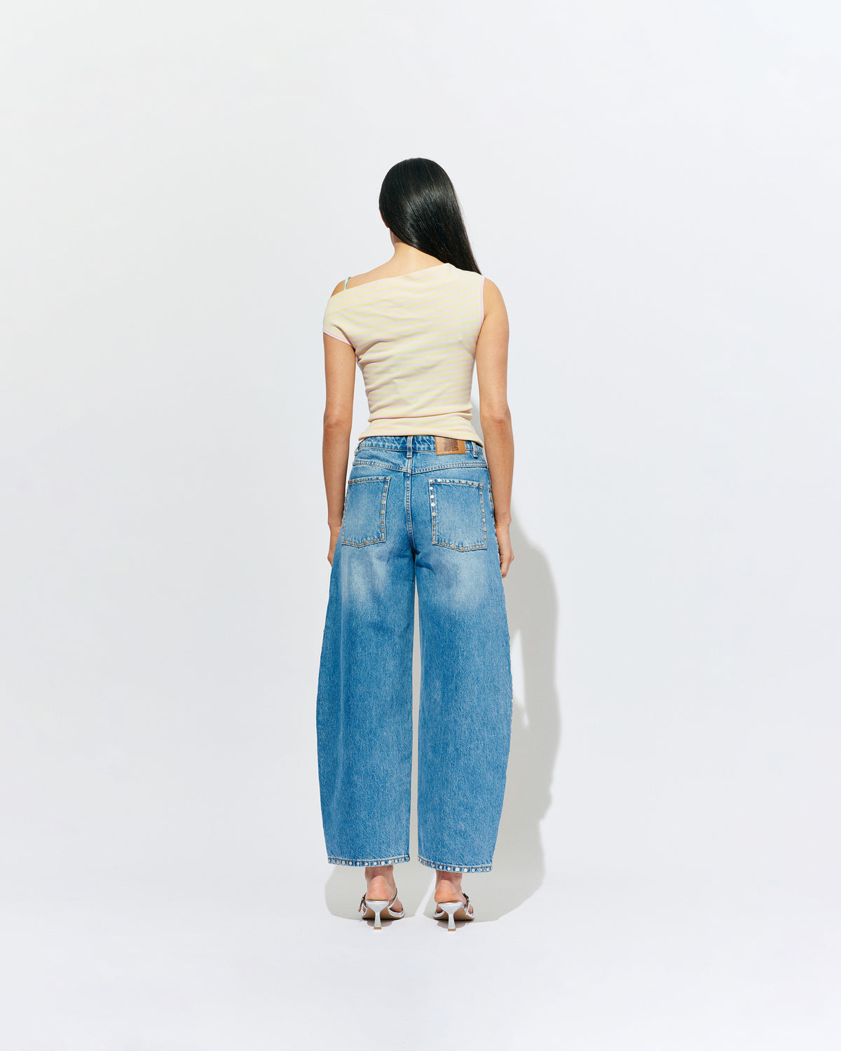 ICON STUDDED JEAN MIDTOWN BLUE | Barrel-leg jean designed in our signature midtown blue wash denim with studded seams. Sits mid to high-waisted with classic 5 pocket and waistband detailing. An updated version of our Icon Jean.