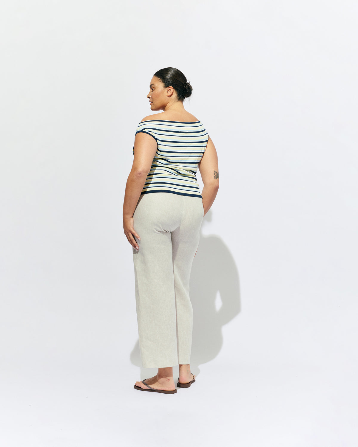 EMMA KNIT TOP LEMON NAVY STRIPE | Off-shoulder knitted top crafted in a lemon navy stripe, mid-weight knit. This top is simple yet fun and can be worn on or off the shoulder.