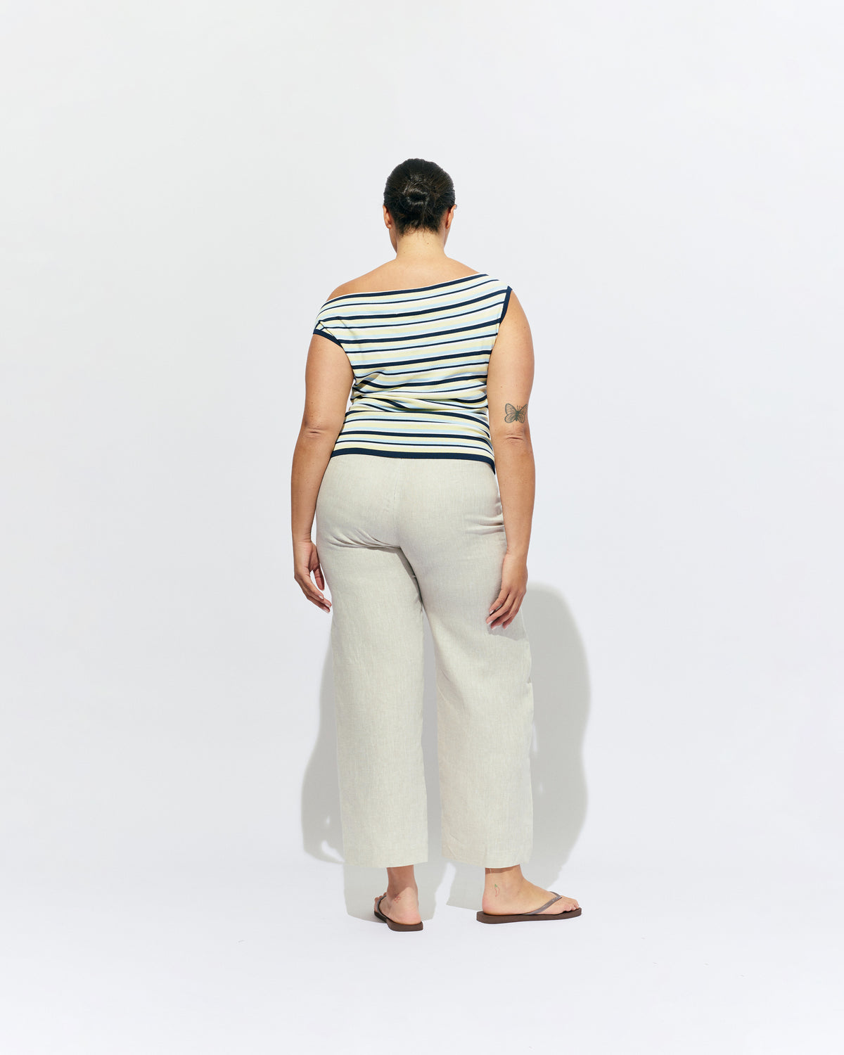 EMMA KNIT TOP LEMON NAVY STRIPE | Off-shoulder knitted top crafted in a lemon navy stripe, mid-weight knit. This top is simple yet fun and can be worn on or off the shoulder.