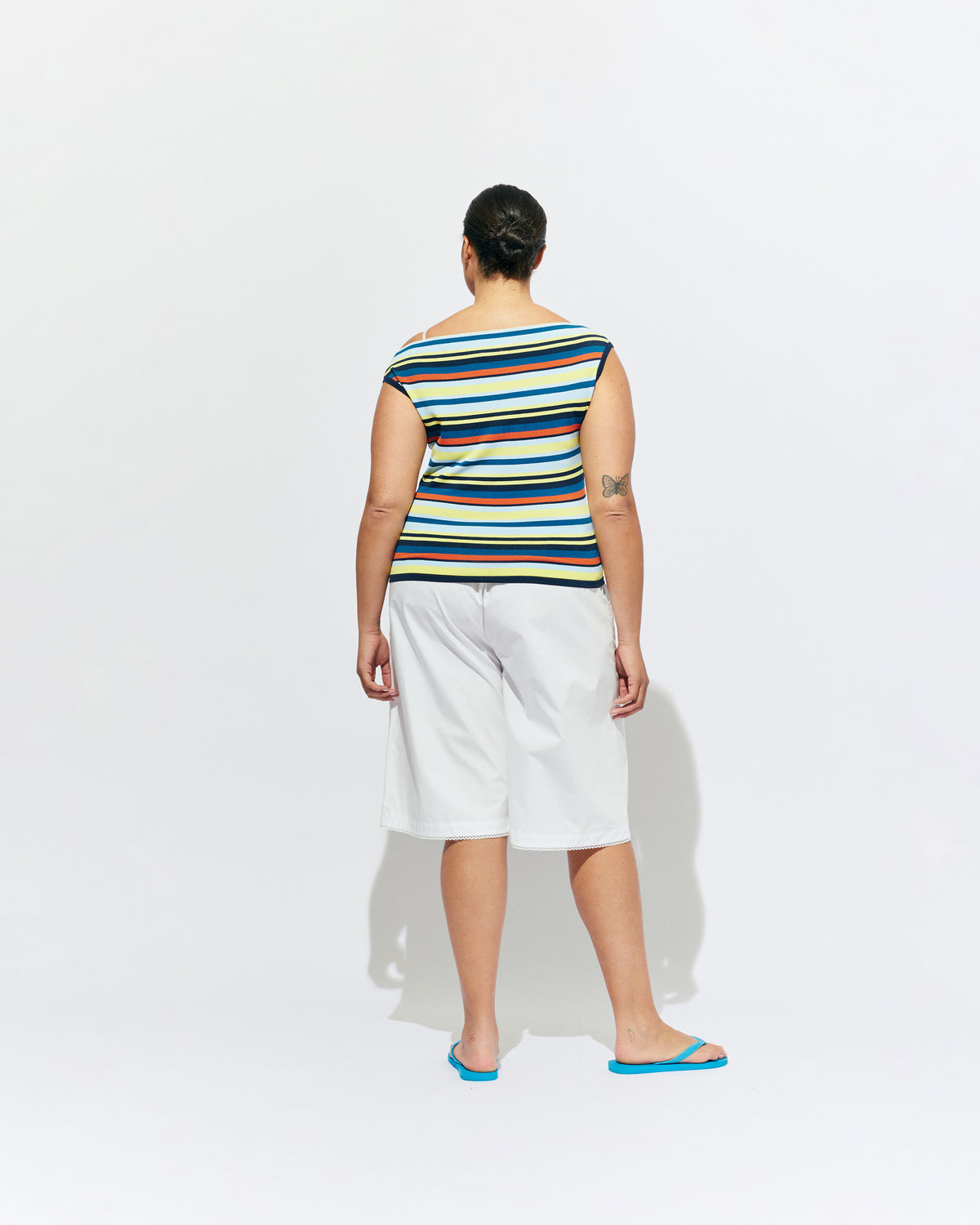 EMMA KNIT TOP MARINE STRIPE | Off-shoulder knitted top crafted in a marine stripe, mid-weight knit. This top is simple yet fun and can be worn on or off the shoulder.