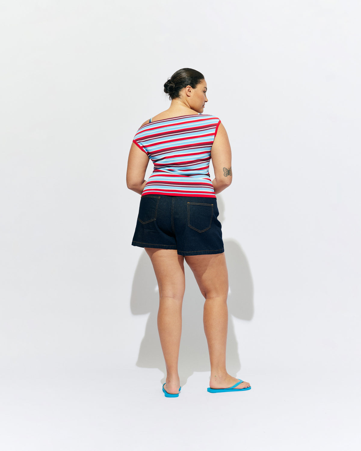 EMMA KNIT TOP POPSICLE STRIPE | Off-shoulder knitted top crafted in a popsicle stripe, mid-weight knit. This top is simple yet fun and can be worn on or off the shoulder.