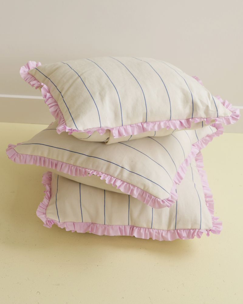  LIL RUFFLE RECYCLED CUSHION FINE STRIPE | Our very own RUBY cushions have arrived! Medium-sized decor cushion designed in a cream and navy stripe, with a feature lilac ruffle around the edge. With its neutral colouring and pop...