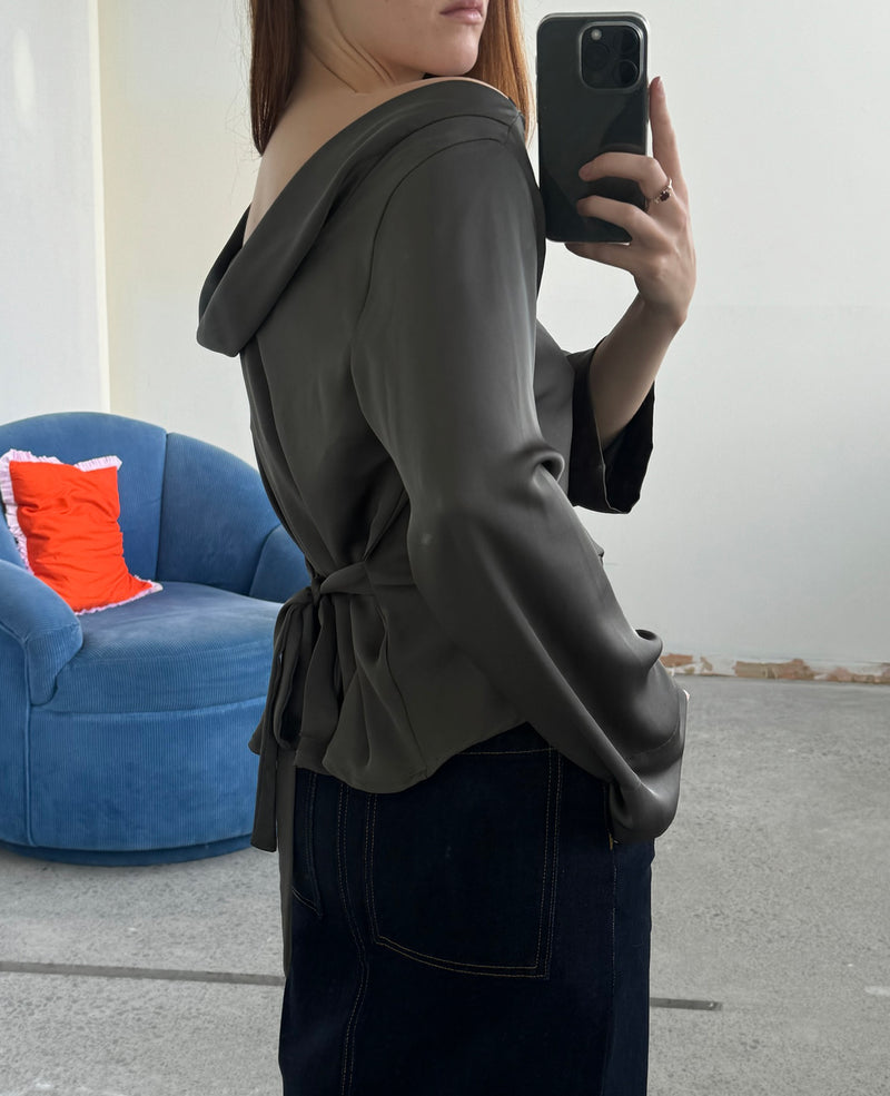 FIREBIRD SATIN COWL TOP CHARCOAL | Longsleeve blouse with a cowl neck scoop back, crafted in lush charcoal satin. A minimal silhouette with an unexpected detail in the draped back neck and a tie to cinch...