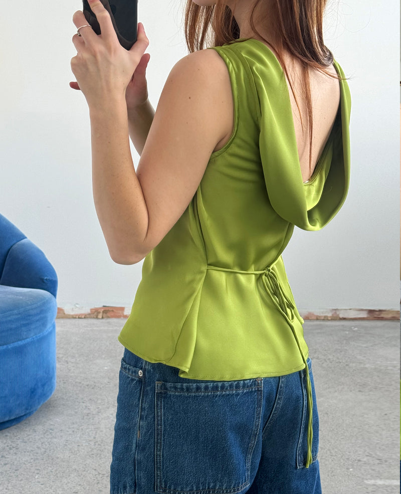 FIREBIRD COWL SLEEVELESS TOP PEA GREEN | Sleeveless top crafted in a luxe pea green satin. Features a minimal silhouette with a cowl back detail and a tie to cinch in the waist. Find out more about...