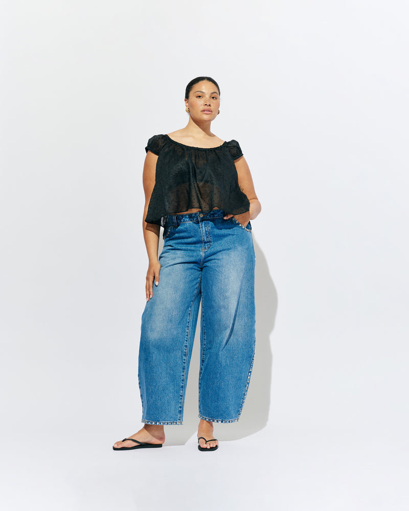 ICON STUDDED JEAN MIDTOWN BLUE | Barrel-leg jean designed in our signature midtown blue wash denim with studded seams. Sits mid to high-waisted with classic 5 pocket and waistband detailing. An updated version of our Icon Jean.