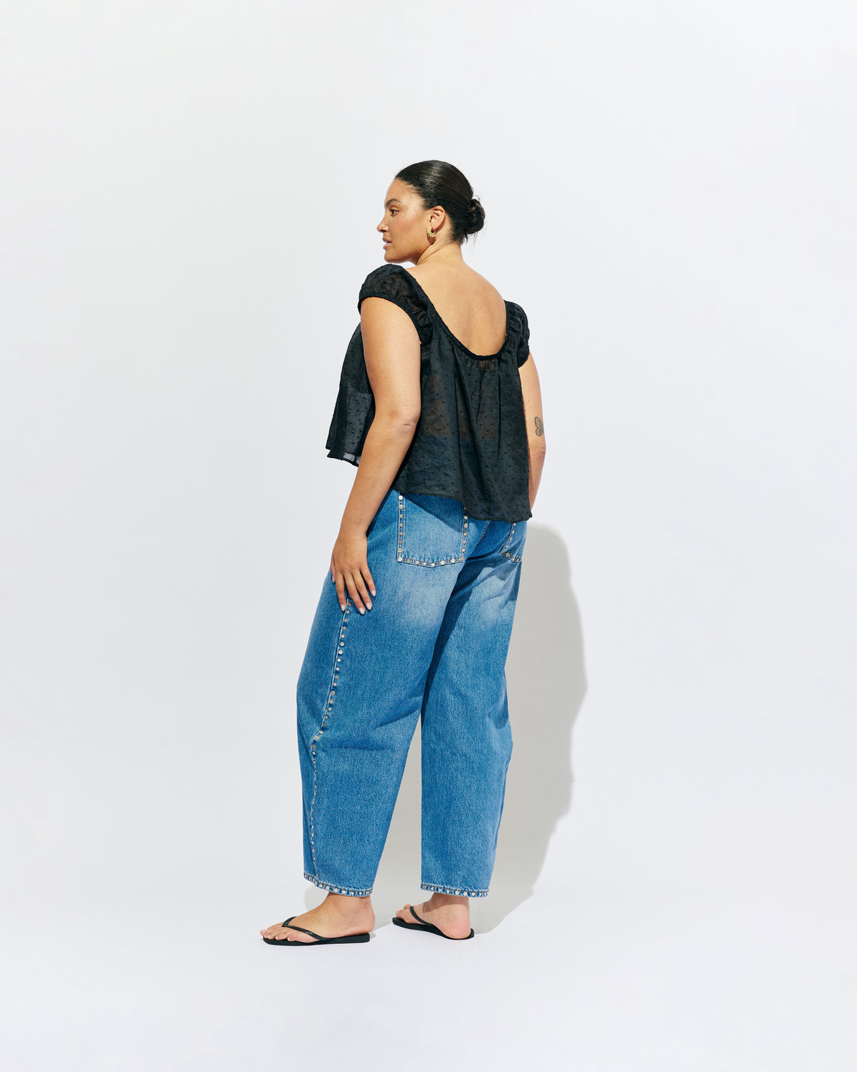 ICON STUDDED JEAN MIDTOWN BLUE | Barrel-leg jean designed in our signature midtown blue wash denim with studded seams. Sits mid to high-waisted with classic 5 pocket and waistband detailing. An updated version of our Icon Jean.