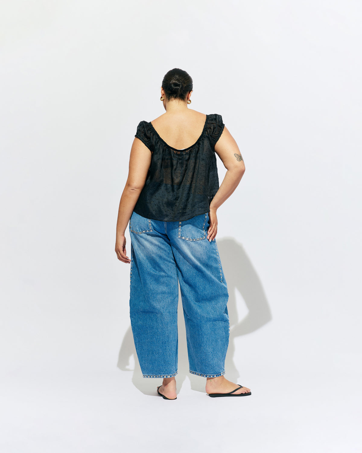 ICON STUDDED JEAN MIDTOWN BLUE | Barrel-leg jean designed in our signature midtown blue wash denim with studded seams. Sits mid to high-waisted with classic 5 pocket and waistband detailing. An updated version of our Icon Jean.