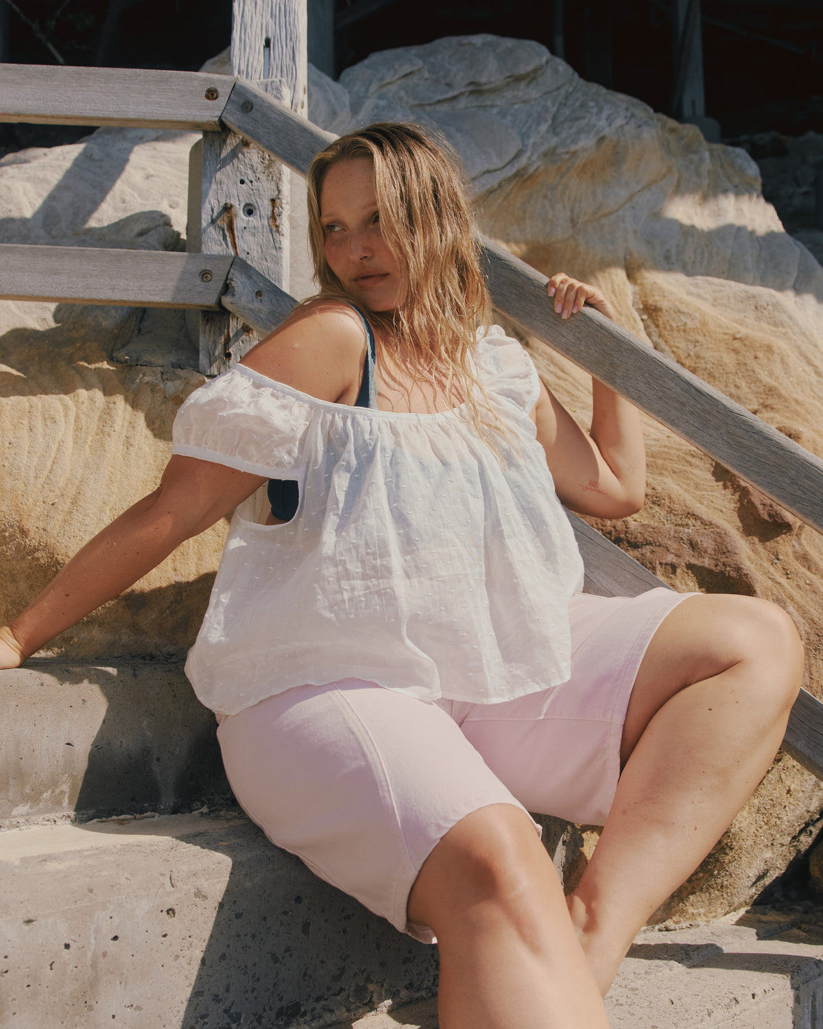 FRECKLE BLOUSE WHITE | Puff sleeve blouse, created in a lightweight semi-sheer ramie fabric, with a textured polka dot design. With a wide neckline that can be worn on or off the shoulder, and a flowy silhouette through the body, this top is the...