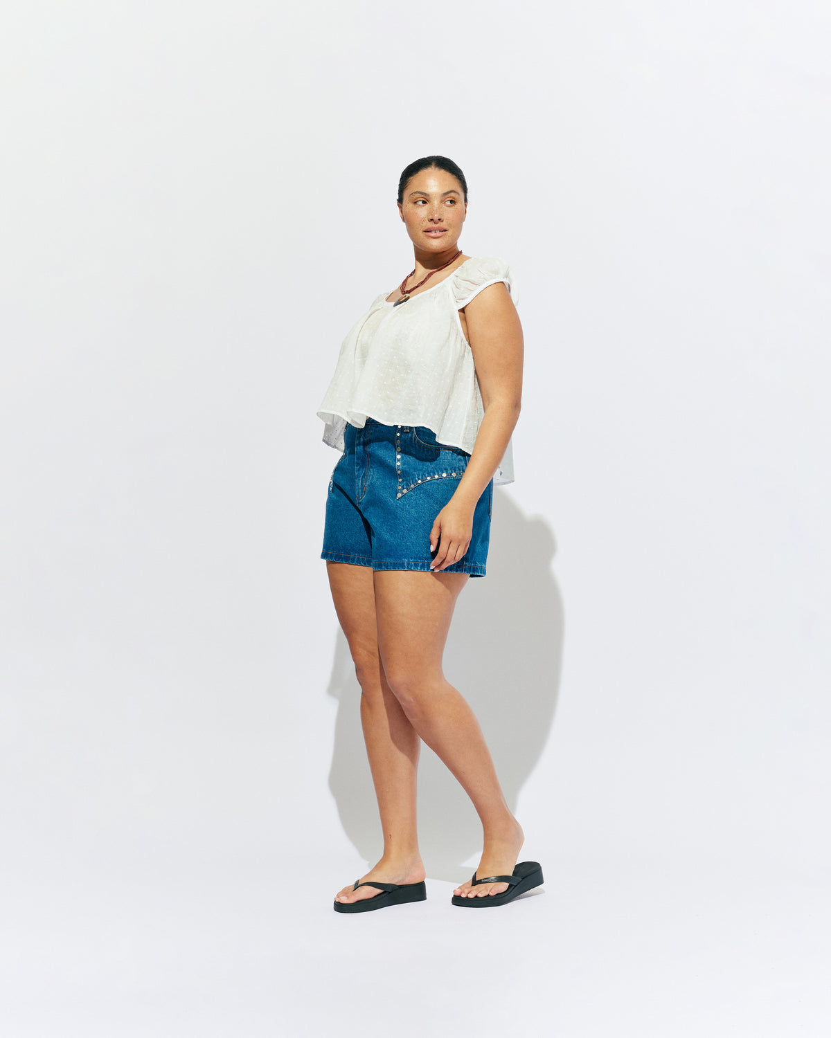 FRECKLE BLOUSE WHITE | Puff sleeve blouse, created in a lightweight semi-sheer ramie fabric, with a textured polka dot design. With a wide neckline that can be worn on or off the shoulder, and a flowy silhouette through the body, this top is the...