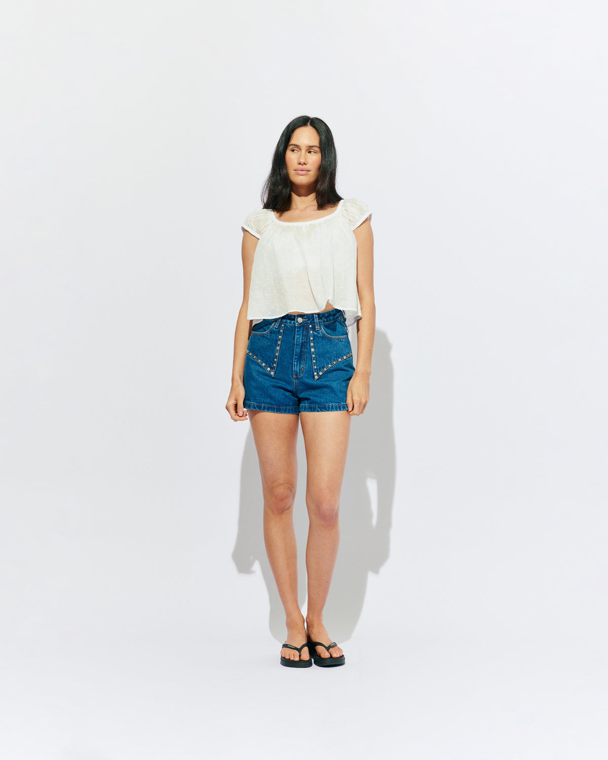 CLOVER STUDDED DENIM SHORT INDIGO | An update on the classic high waisted denim short with retro four pocket detailing and studded seams. Made in a soft washed indigo denim, these are an essential summer companion for all Rubettes.