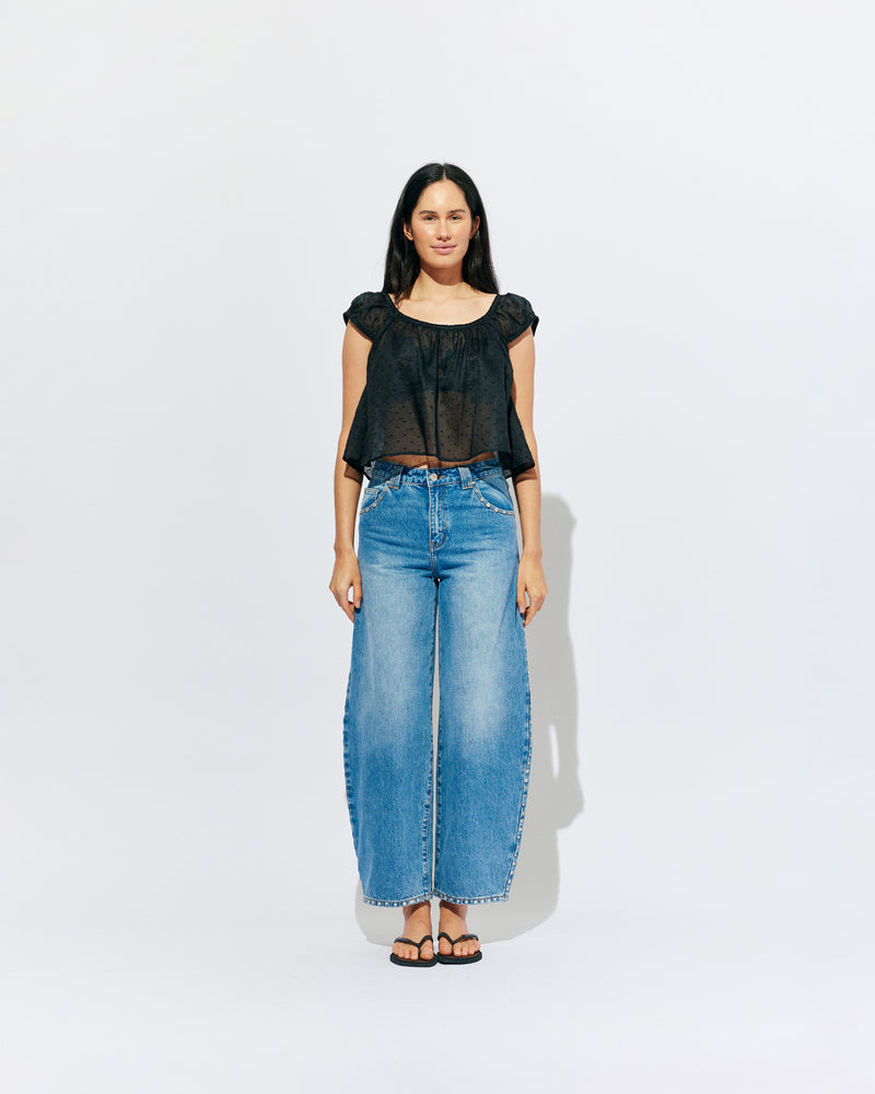 ICON STUDDED JEAN MIDTOWN BLUE | Barrel-leg jean designed in our signature midtown blue wash denim with studded seams. Sits mid to high-waisted with classic 5 pocket and waistband detailing. An updated version of our Icon Jean.