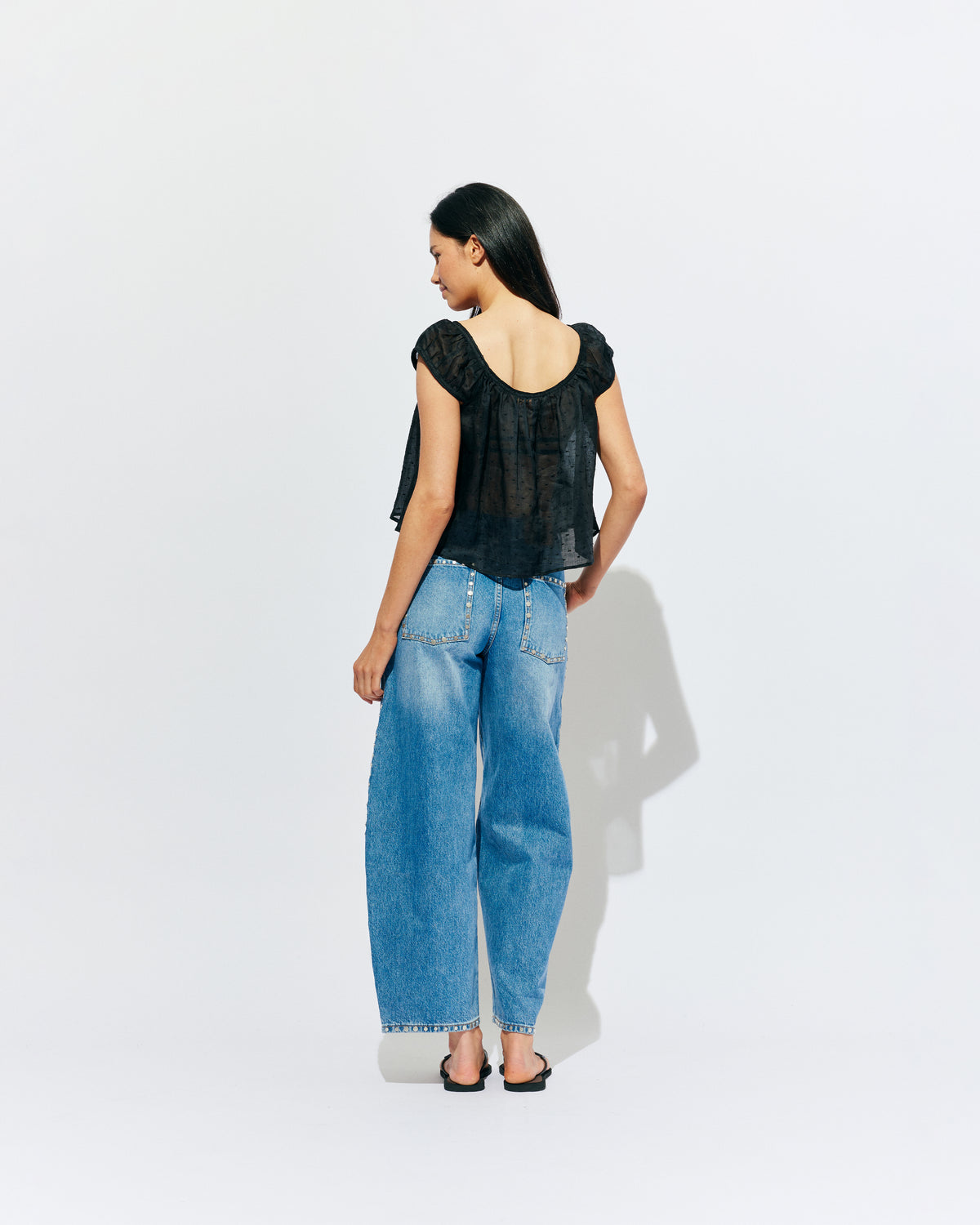 ICON STUDDED JEAN MIDTOWN BLUE | Barrel-leg jean designed in our signature midtown blue wash denim with studded seams. Sits mid to high-waisted with classic 5 pocket and waistband detailing. An updated version of our Icon Jean.