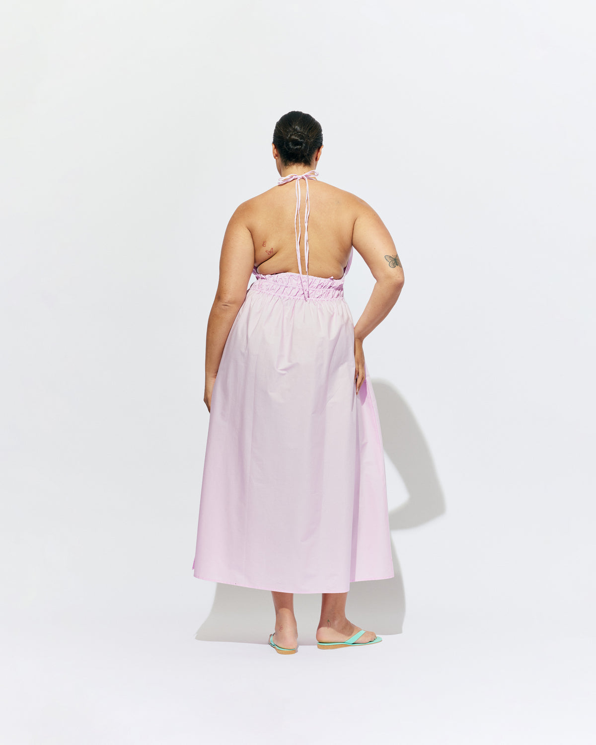 HERO MAXI DRESS SOFT PINK | Double strap maxi dress with a plunge neckline, shirred waist detail, and side split in a pink organic cotton. A Rubette favourite for any occasion, from weddings to workwear and more.