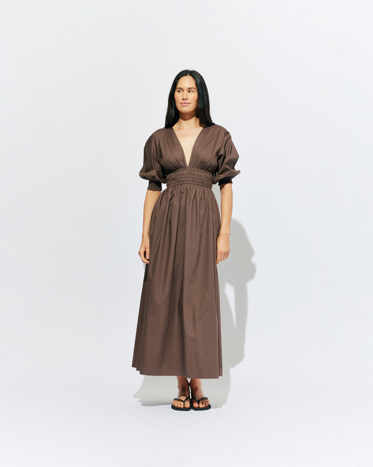 HERO PUFF SLEEVE MAXI DRESS BROWN | An update to our Hero Maxi Dress, this puff sleeve maxi dress features a plunge neckline, shirred waist detail, and side split in a brown organic cotton. A Rubette favourite for any occasion, from weddings to workwear and more.