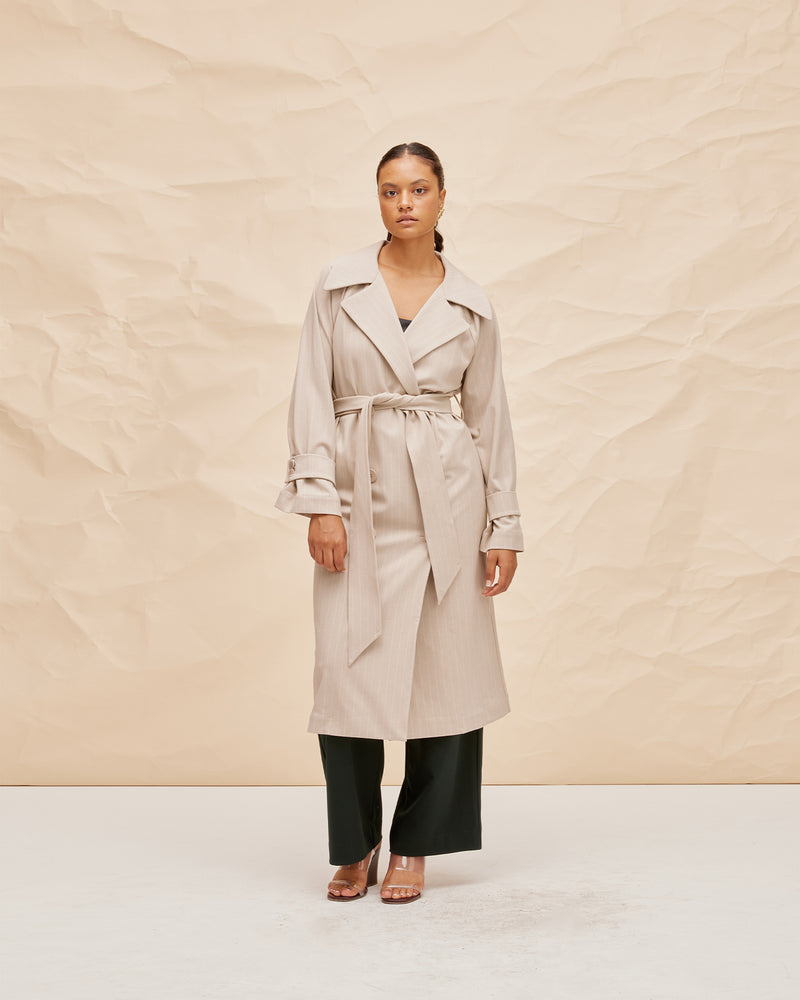  JEMIMA TRENCH COAT CAMEL PINSTRIPE | Oversized midi length trench with front waist ties, black button fastenings and a wide collar. A classic shape imagined in mid-weight camel pinstripe fabric. 
