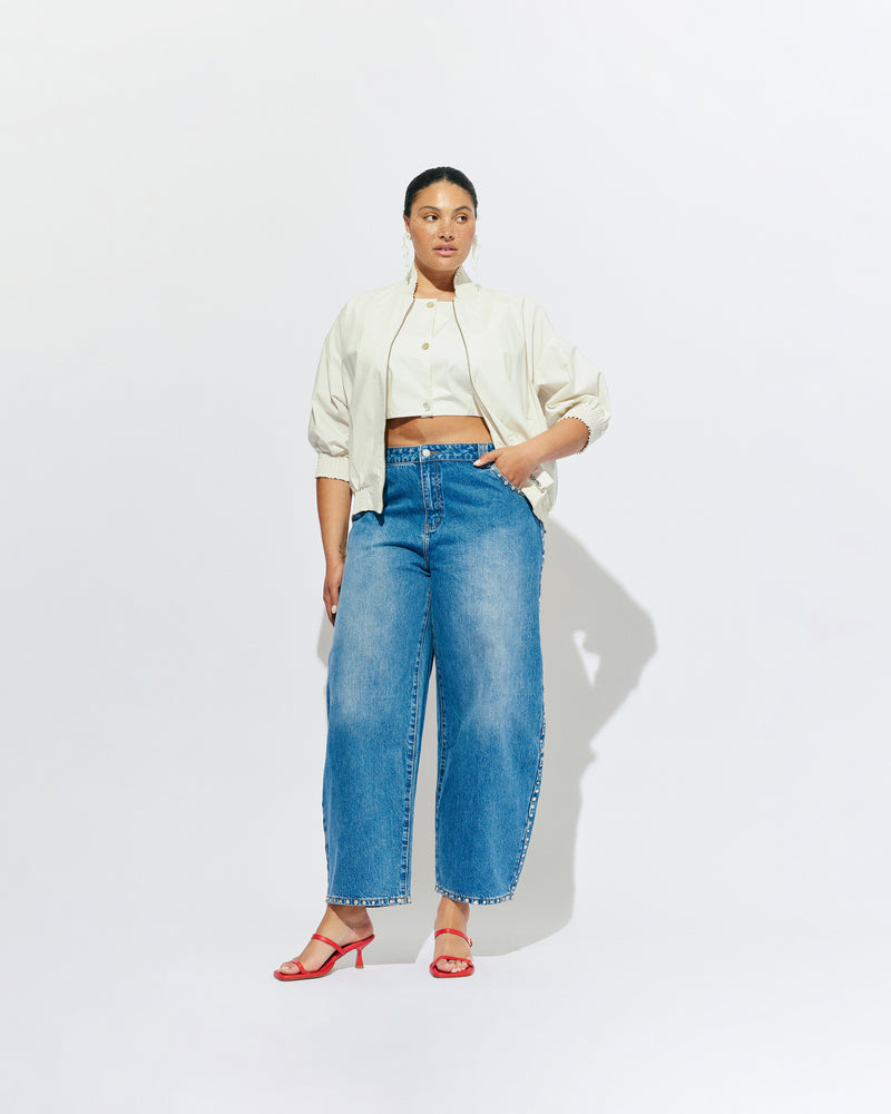 JOEY BOMBER CREAM | Statement jacket and tank combined, designed in a cream colourway organic cotton. Featuring cropped sleeves, gathered detailing and a bomber style fit jacket, which overlay a built-in cropped top. Pair this jacket with denim for an elevated everyday look. 