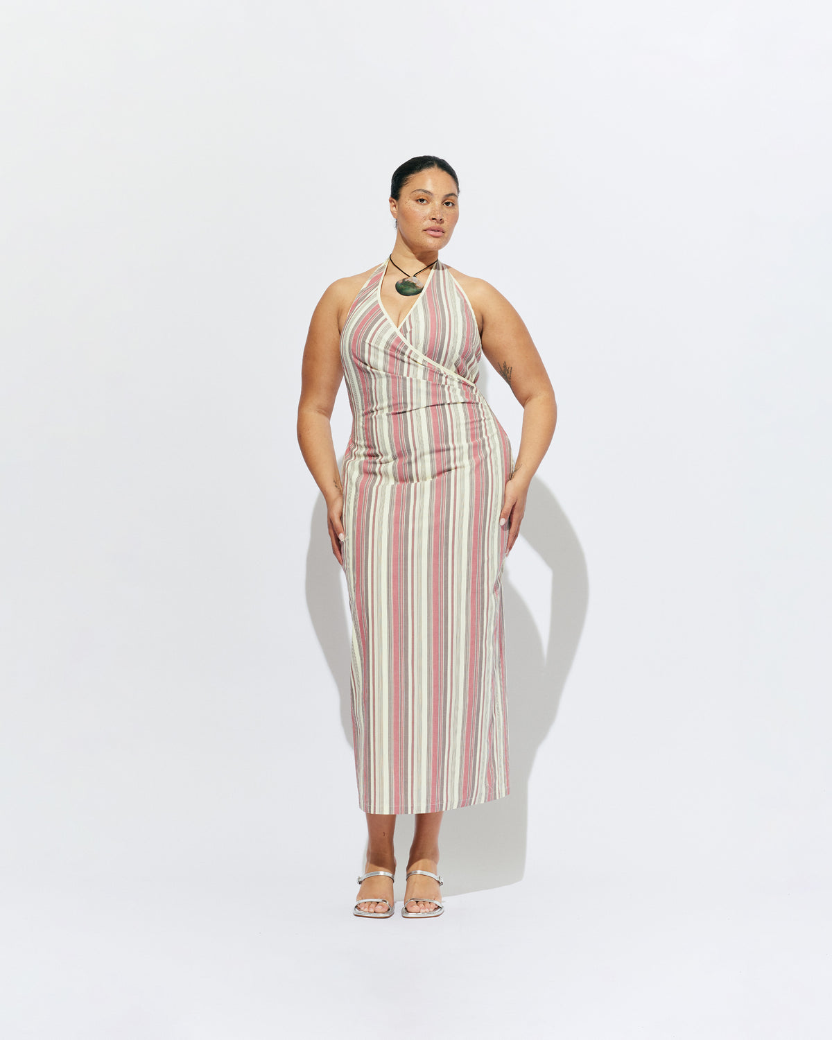 JOEY DRESS ANASE STRIPE | Bias cut midi dress with a tie-up halter neckline, crafted in our anase stripe organic cotton. Designed with ruching details on the waist and back for a tailored fit through the body, which falls into a straight cut skirt with...