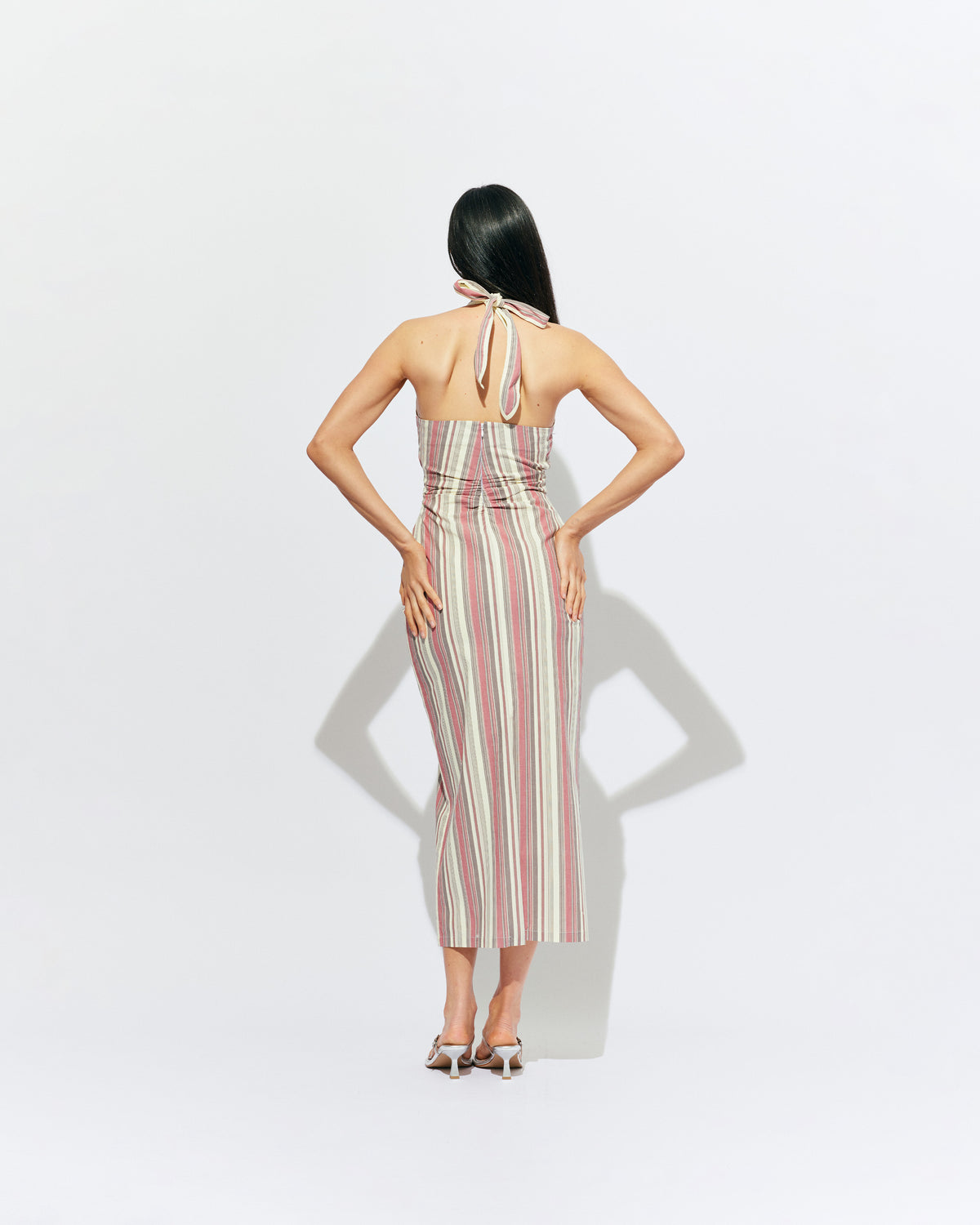 JOEY DRESS ANASE STRIPE | Bias cut midi dress with a tie-up halter neckline, crafted in our anase stripe organic cotton. Designed with ruching details on the waist and back for a tailored fit through the body, which falls into a straight cut skirt with...