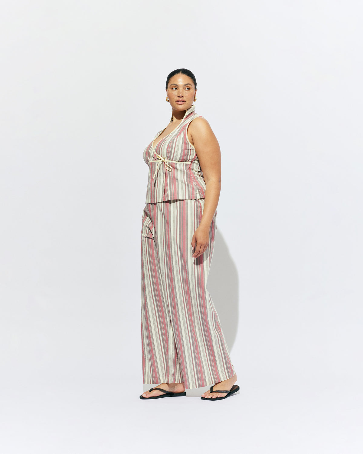 SONNY PANT ANASE STRIPE | Straight leg cotton pant with a flat elastic waistband, designed in our anase striped cotton. These pants sit relaxed and wide and have side and back pockets, with a feature embroidered RUBY 'R' on the back pocket. Make it a...