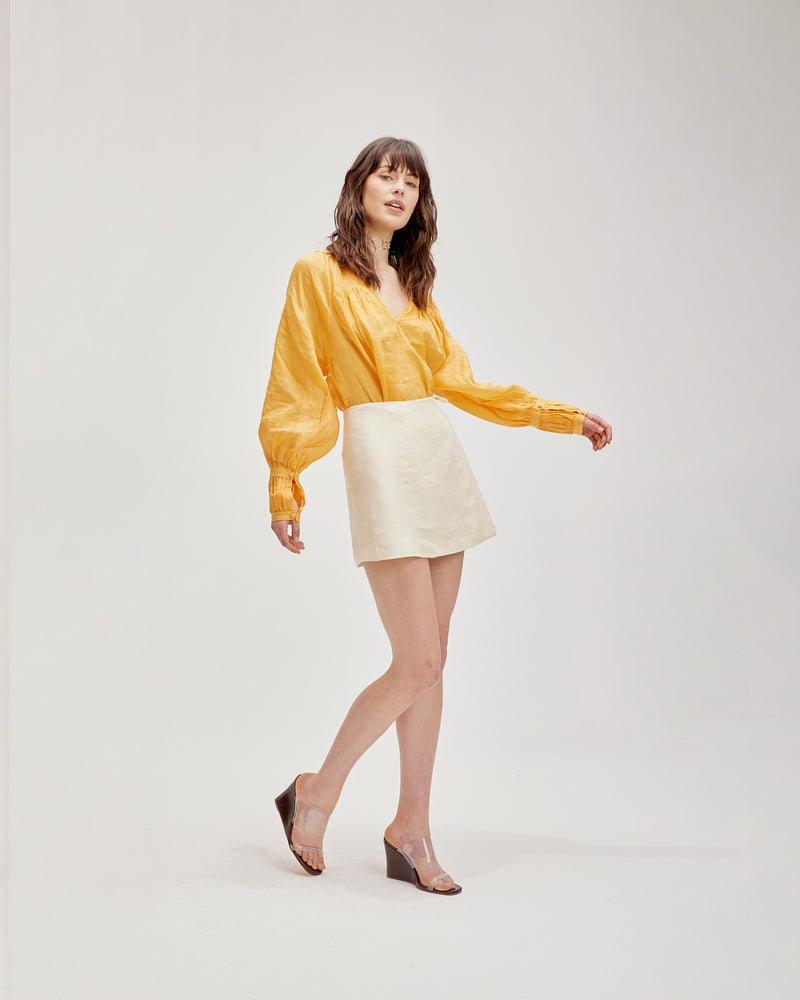 KOS LINEN MINI SKIRT LEMONADE | Linen wrap mini skirt designed in a soft lemon shade. This skirt is versatile in that it can be worn high or low waisted, as a set with the matching...